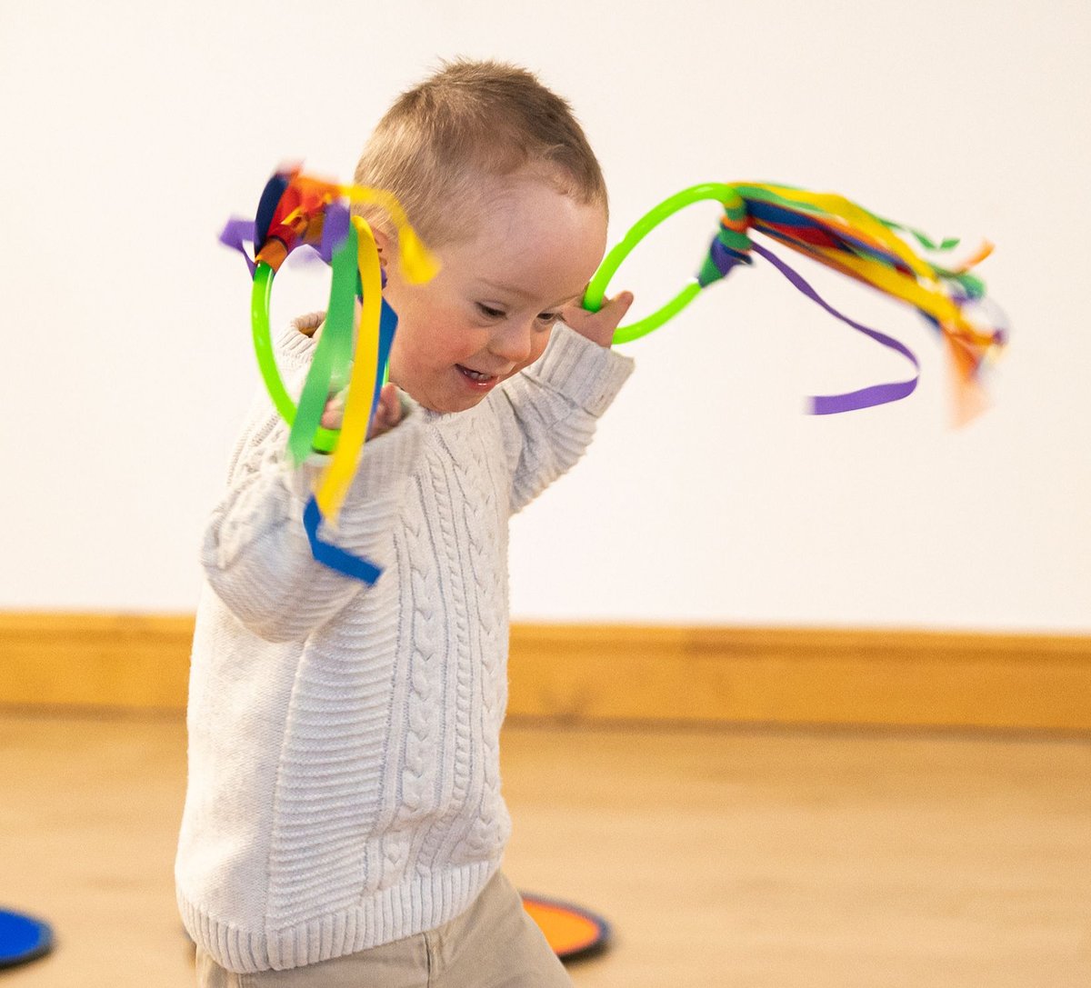 Children waving ribbons at a Rhythm Time class